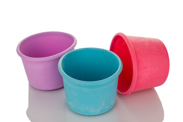 Three silicone molds for baking, macro, isolated on white background.