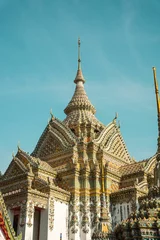 Deurstickers Beautiful ornamental architecture of Wat Pho Buddhist temple in Bangkok, Thailand. © Alexanderkaufmann/Wirestock Creators