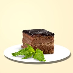 Piece of tasty sweet cake with mint on the desk