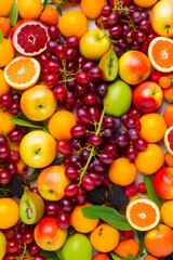 Naklejka na ściany i meble Close up of bunch of fruit with oranges, apples, grapefruits, and kiwis. Generative AI.
