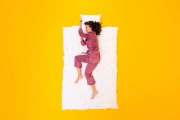 Lady Sleeping Lying On Blanket And Pillow Over Yellow Background