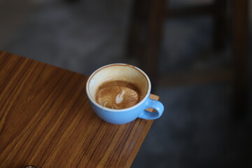 latte art on te wood table in the coffee shop