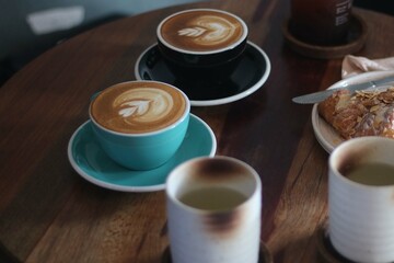 latte art on te wood table in the coffee shop