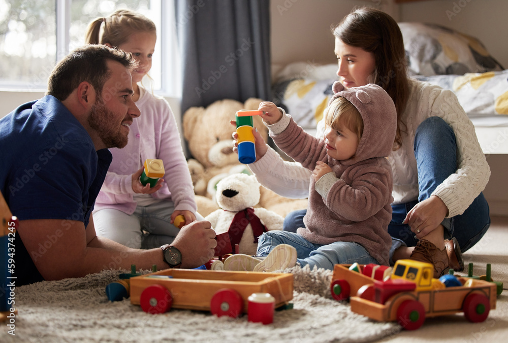 Poster Theres nothing more precious than family time. a young family playing together at home.