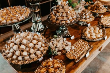 Closeup of a festive table with a pile of sweets during the ceremony
