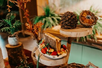 A closeup of a festive table with a variety of sweets and snacks served during the ceremony