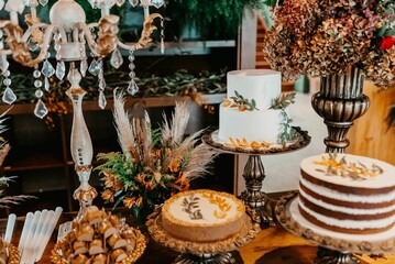 there is an image of a table with a lot of cakes and desserts