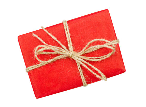 Gift box packed with red craft paper and twine isolated on transparent background