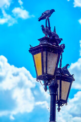 Fototapeta na wymiar dirty Vintage retro lanterns against the sky in the old town of warsaw, poland