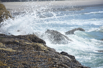 wave splashing against rocks