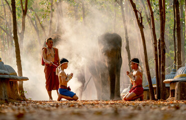 Two Asian men sit and action with traditional martial art fight position before start of fighting...
