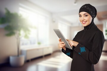 Arab happy young woman using digital tablet