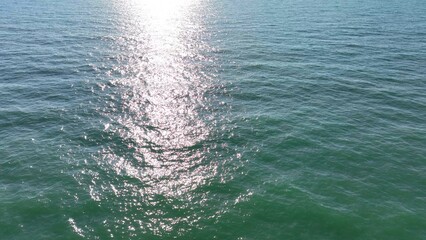 Aerial of morning sunlight on Atlantic ocean waves along the coastline of South Carolina