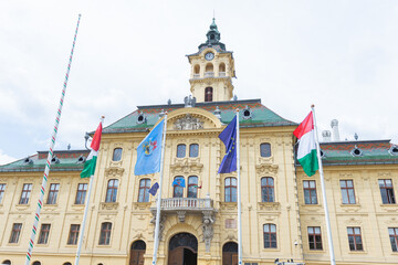 Fototapeta na wymiar Vintage town hall building stands tall and proud in the heart of Szeged, Hungary - a picturesque cityscape full of history and culture.