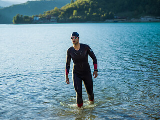 A triathlon swimmer preparing for a river training to gear up for a marathon