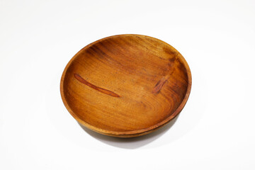 The brown wooden plate closeup. Isolated On White Background