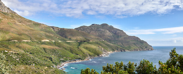 A photo of mountains, coast and ocean from Shapmanns Peak,. A photo mountains, coast and ocean from Shapmanns Peak, with Hout Bay in the background. Close to Cape Town.