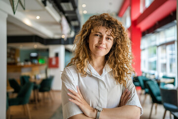 Portrait of one caucasian woman stand happy confident at cafe indoor