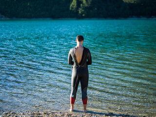 A triathlon swimmer preparing for a river training to gear up for a marathon