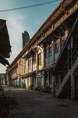 Vertical shot of old buildings under a blue sky in Thailand, asia