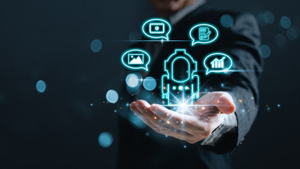 man hold bot icon and command prompt ai chat ability to create photos,compose song and novels,make videos,stock trading,ai disruption in many professions.Digital Artificial Intelligence(AI) technology