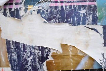 Torn street poster background. Abstract ripped old paper collage