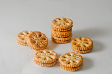 Several round biscuits with peanut butter isolated on a white background