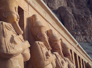Egyptian statues outside the Mortuary Temple of Hatshepsut in Luxor, Egypt