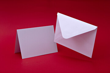 White envelope with blank white postcard. Mockup of love letter. Urgent message concept. Important information.