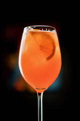 Delicious Aperol spritz cocktail standing on bar counter in restaurant bar waiting for waiter and...