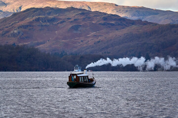 Steam-boat in Lake in Lake District, the UK, December 2023