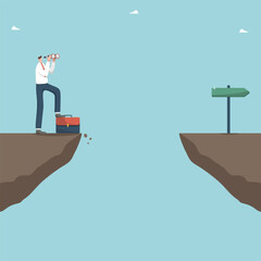 Planning the future development of the business, think over a strategy or plan to achieve the goals, overcoming difficulties and solving business problems, a man looks through binoculars on a cliff.