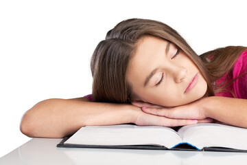 Schoolgirl sleeping on school book. Isolated on white background