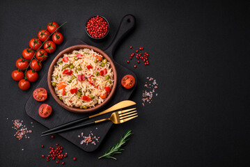 Delicious boiled rice with vegetables peppers, carrots, peas and asparagus beans