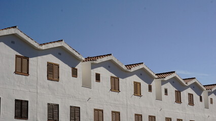 line of house facades against the sky