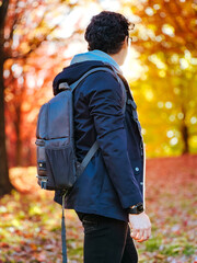 man walking in autumn park