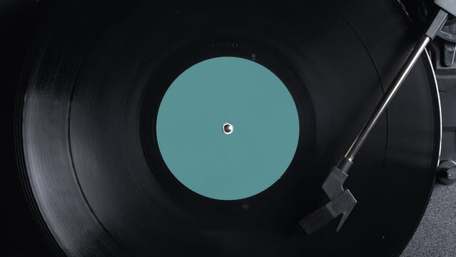 Close up of a vintage retro vinyl record rotating. Old fashioned music. Needle gramophone. 4K ProRes