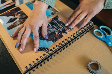 Close-up image of the hands of an unrecognizable middle-aged woman making sure that the piece of...