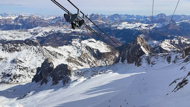 Skiing season footage on top of Marmolada glacier, the highest point in the Dolomites mountains in Italy	