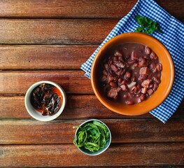 fresh beans in rustic ceramic bowl and wooden background