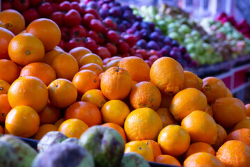 Ripe oranges on a market counter. High quality photo