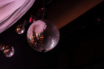 Three typical dance club mirror balls