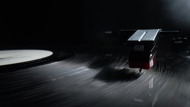 Close up of a vintage retro vinyl record rotating. Old fashioned music. Needle gramophone. 4K ProRes