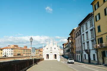 Fototapeta na wymiar Santa Maria della Spina along the Arno river, Pisa, Italy