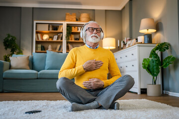 Mature senior man practice guided meditation manifestation at home - Powered by Adobe