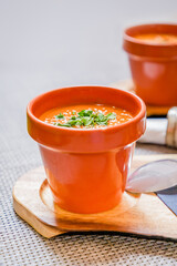Tomato puree soup with parsley in a small bucket