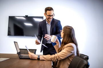Business people having meeting in conference room. Managers analyzing financial reports.