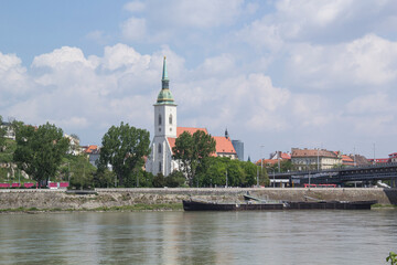 Fototapeta premium Beautiful view of St. Martin's Cathedral on the banks of the Danube in the old town of Bratislava, Slovakia on a sunny summer day 