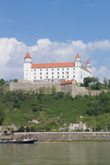 Fototapeta na wymiar Beautiful view of the Bratislava castle on the banks of the Danube in the old town of Bratislava, Slovakia on a sunny summer day