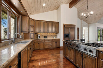 Fototapeta premium a farmhouse kitchen with wood floors and accents